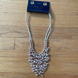 Statement necklace: rose gold on a suede string